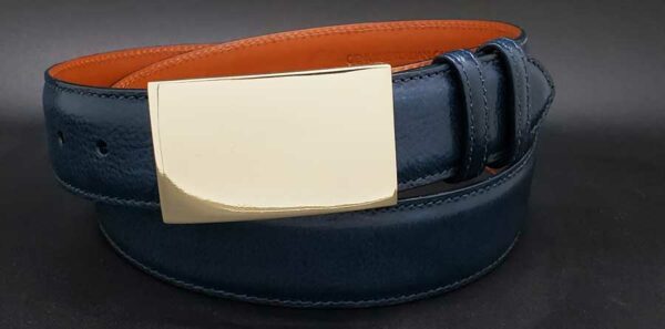 The Rectangle in yellow brass on a navy calf belt