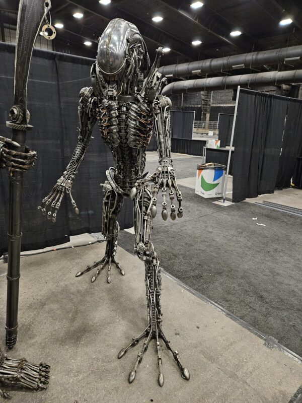 Life Sized Alien-inspired metal sculpture