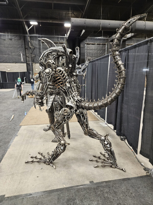 Life Sized Alien-inspired metal sculpture