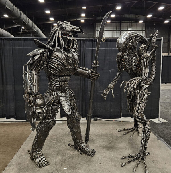 Life Sized Predator-inspired with Alien-inspired metal sculpture